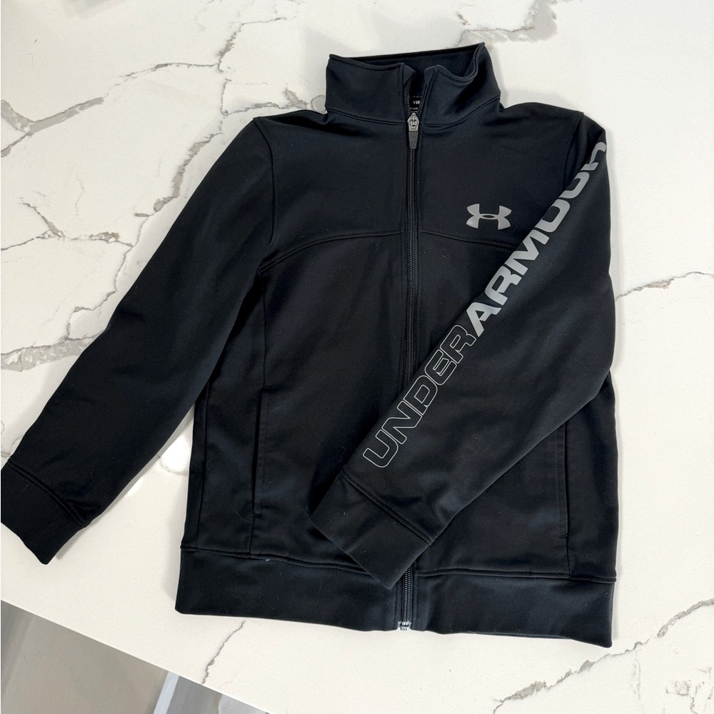 Youth Under Armour full zip up top size small, black with gray lettering.